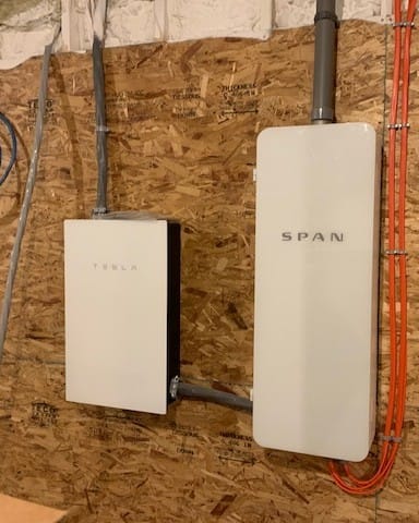 Tesla backup gateway and SPAN smart panel installed side by side by Colonial Electric